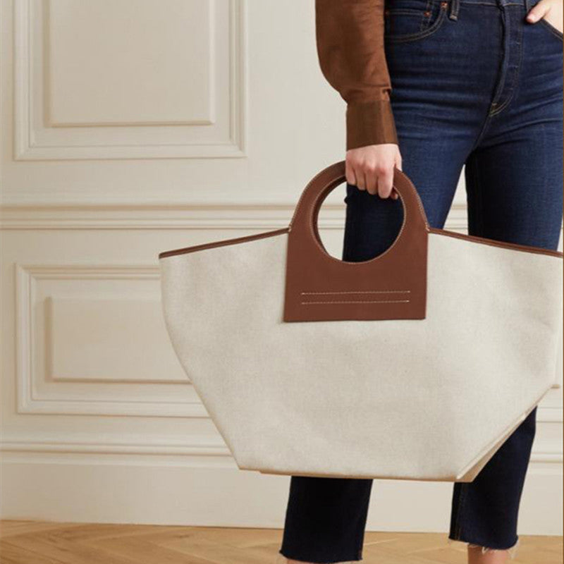 Bolso de viaje moderno con panel de lona y cuero