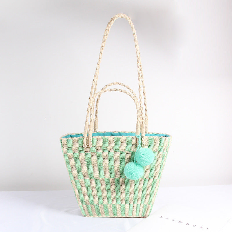 Version coréenne du sac à main à une épaule pour femme en paille avec boule de cheveux