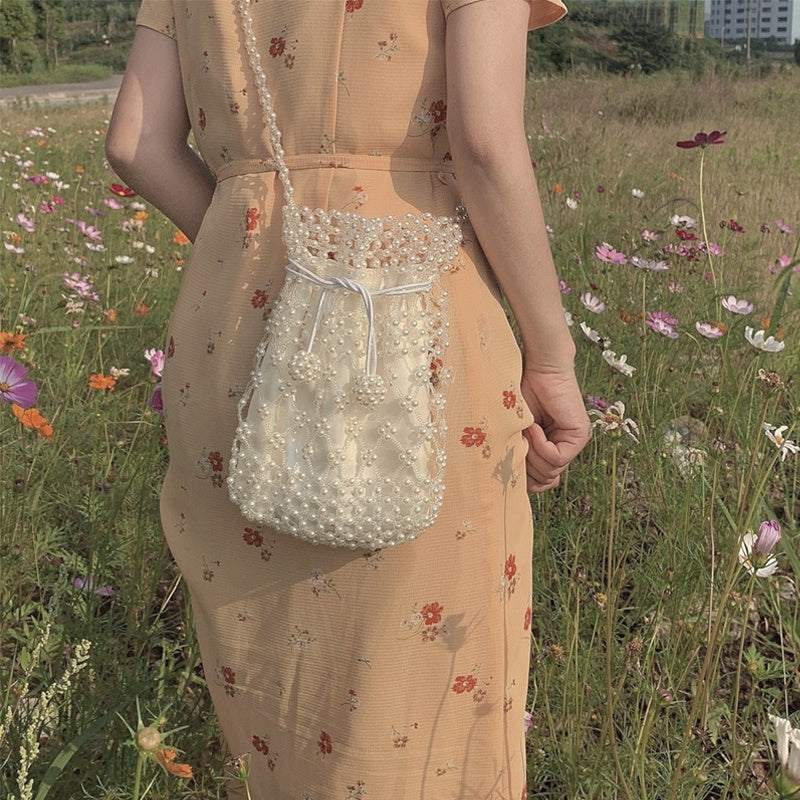 Mochila retro con cierre para mujer, de color blanco crema y tejido de primavera y verano