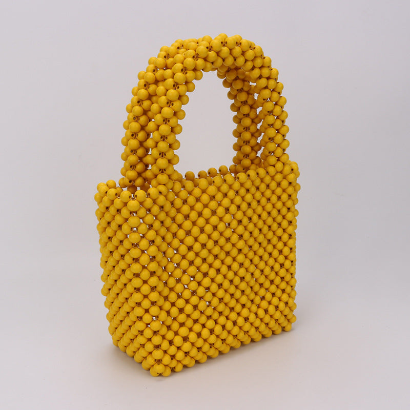 Bolso de mano de moda de color sólido con cuentas de madera y cadena de cuentas redondas