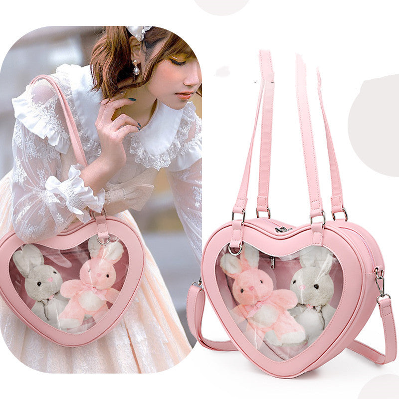 Bolso bandolera transparente con forma de muñeca Love Small Pain