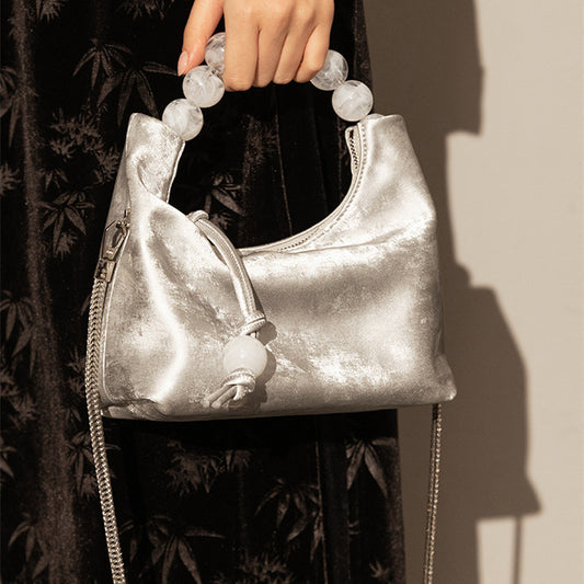 Bolso bandolera con cadena de perlas y hombro Niche