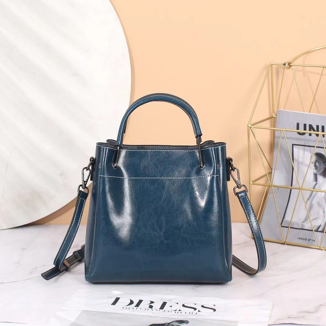 Sac seau portable à bandoulière en cuir pour femme