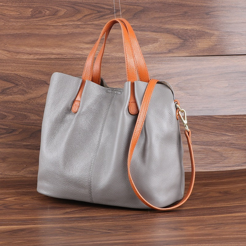 Bolso de mano sencillo e informal de piel suave para mujer