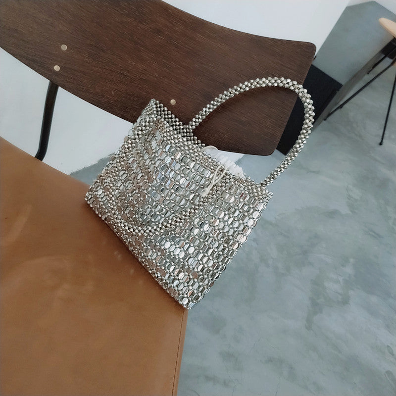 Bolso vintage de metal brillante con cuentas trenzadas a mano