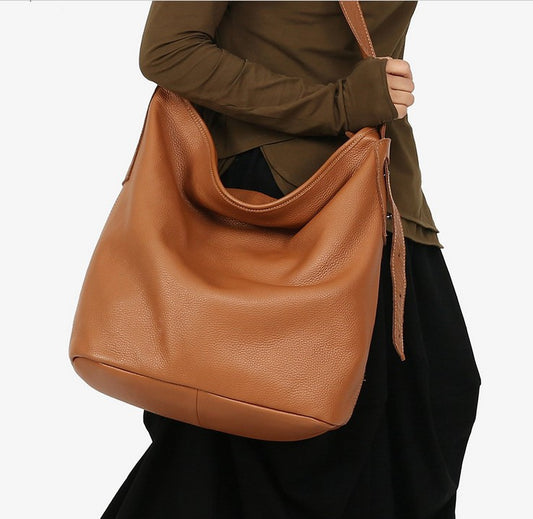 Sac seau simple et polyvalent en cuir de vachette avec première couche de messager à bandoulière