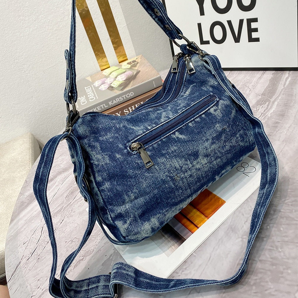 Sac à bandoulière en denim clouté avec perceuse