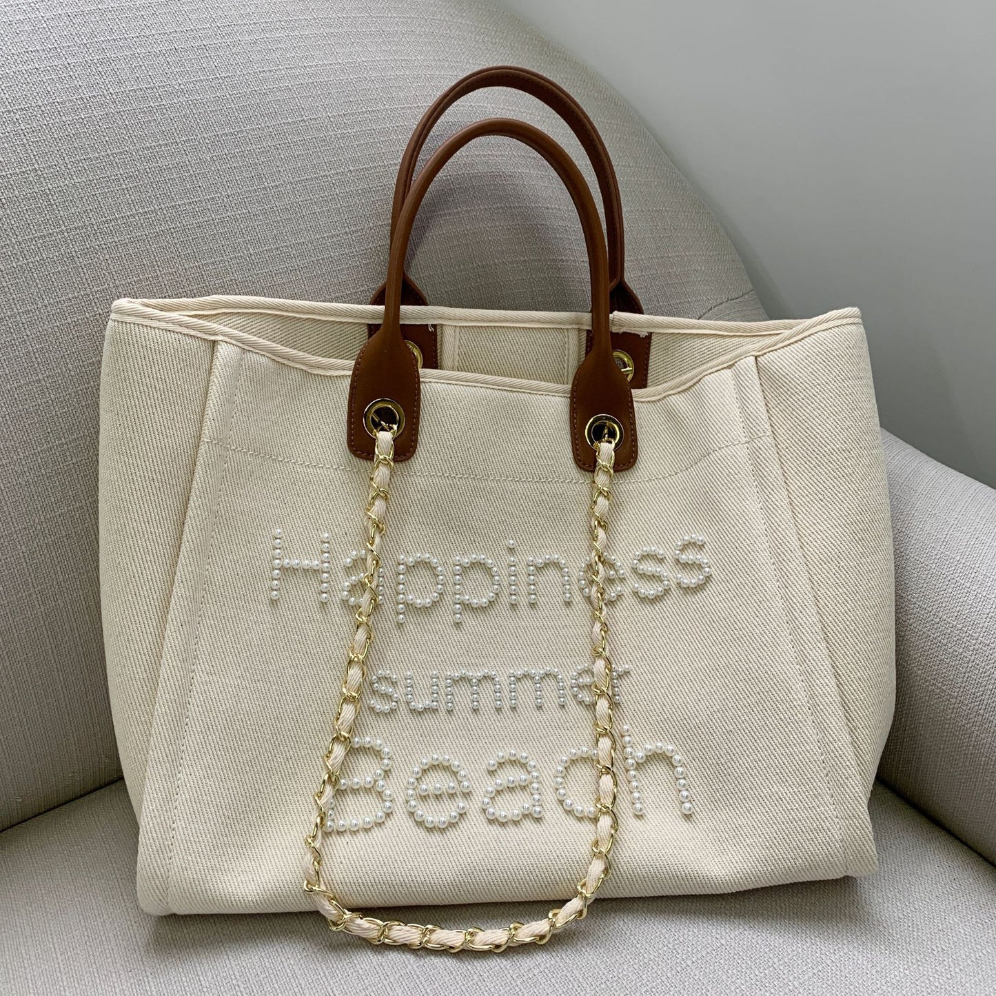 Bolso de playa pequeño de lona perfumada con cadena de cuero y perlas