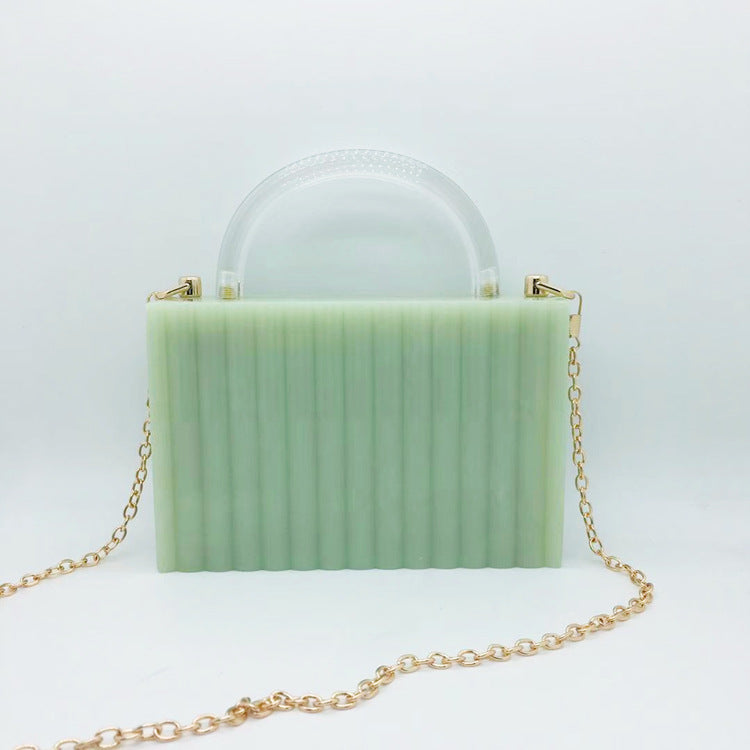 Bolso de mano cuadrado pequeño de acrílico con rayas verticales y asa transparente