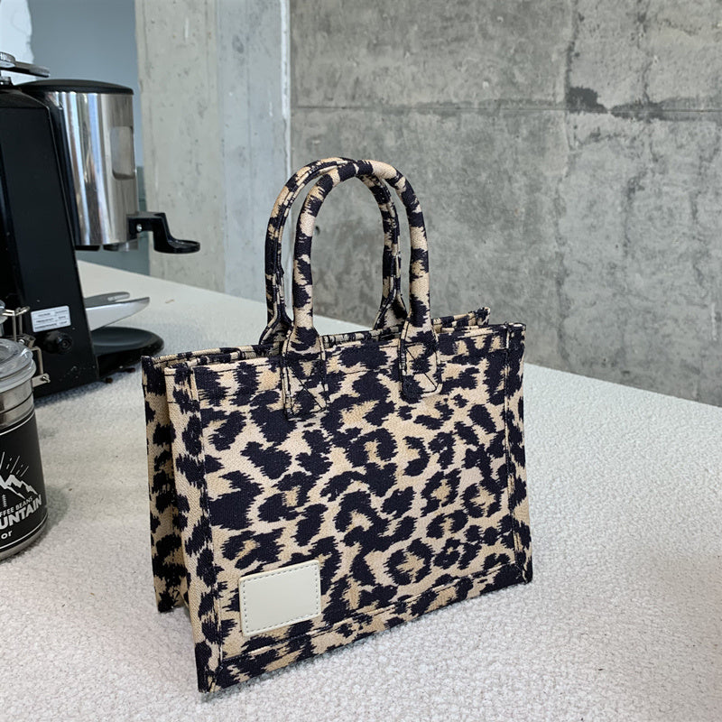 Bolso de mano con estampado de leopardo, de lona, ​​con correa ancha para el hombro, práctico bolso de hombro