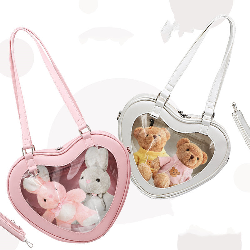 Bolso bandolera transparente con forma de muñeca Love Small Pain