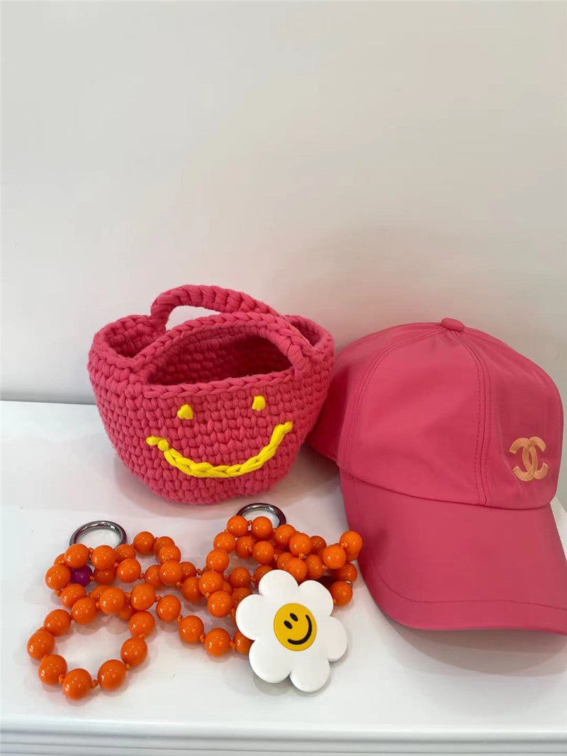 Bolso de mano de estilo occidental tejido a mano con cara sonriente para mujer