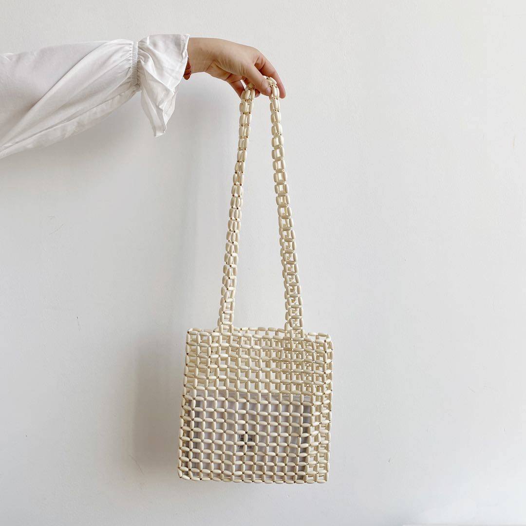 Sac à bandoulière diagonale en perles de bois tissé à la main avec design de niche