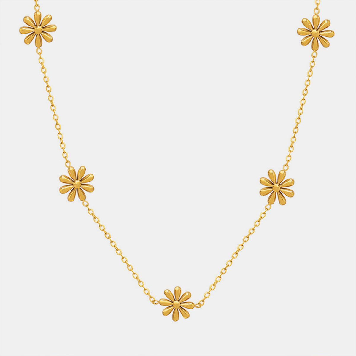 Collier en acier titane en forme de marguerite