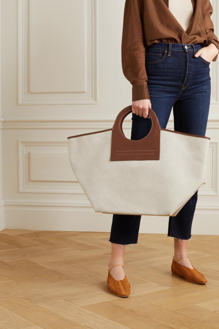 Bolso de viaje moderno con panel de lona y cuero