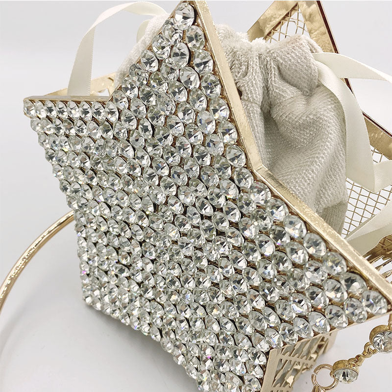 Cartera de mano con forma de estrella y diamantes incrustados