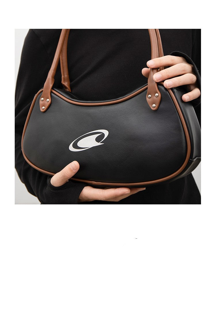 Bolso retro clásico en contraste marrón y negro para debajo del brazo