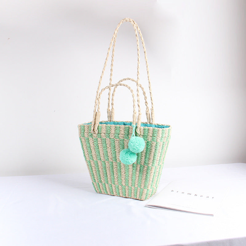 Version coréenne du sac à main à une épaule pour femme en paille avec boule de cheveux