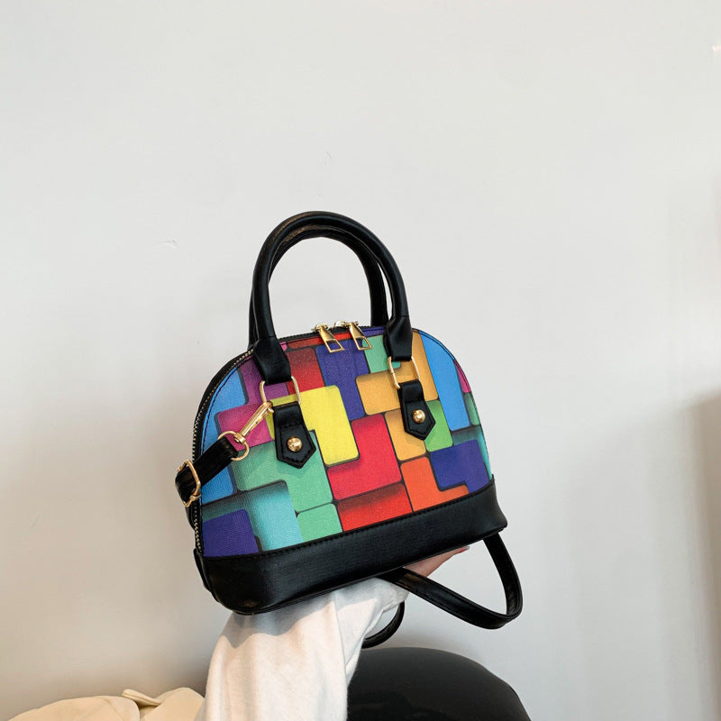 Bolso de mano moderno de alta calidad con costuras en colores contrastantes