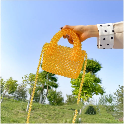 Bolso transparente para mujer con cuentas de colores tejidas a mano